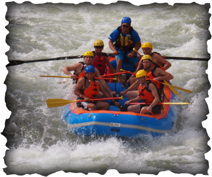 Raft dropping Powerhouse rapid on the Rogue River.